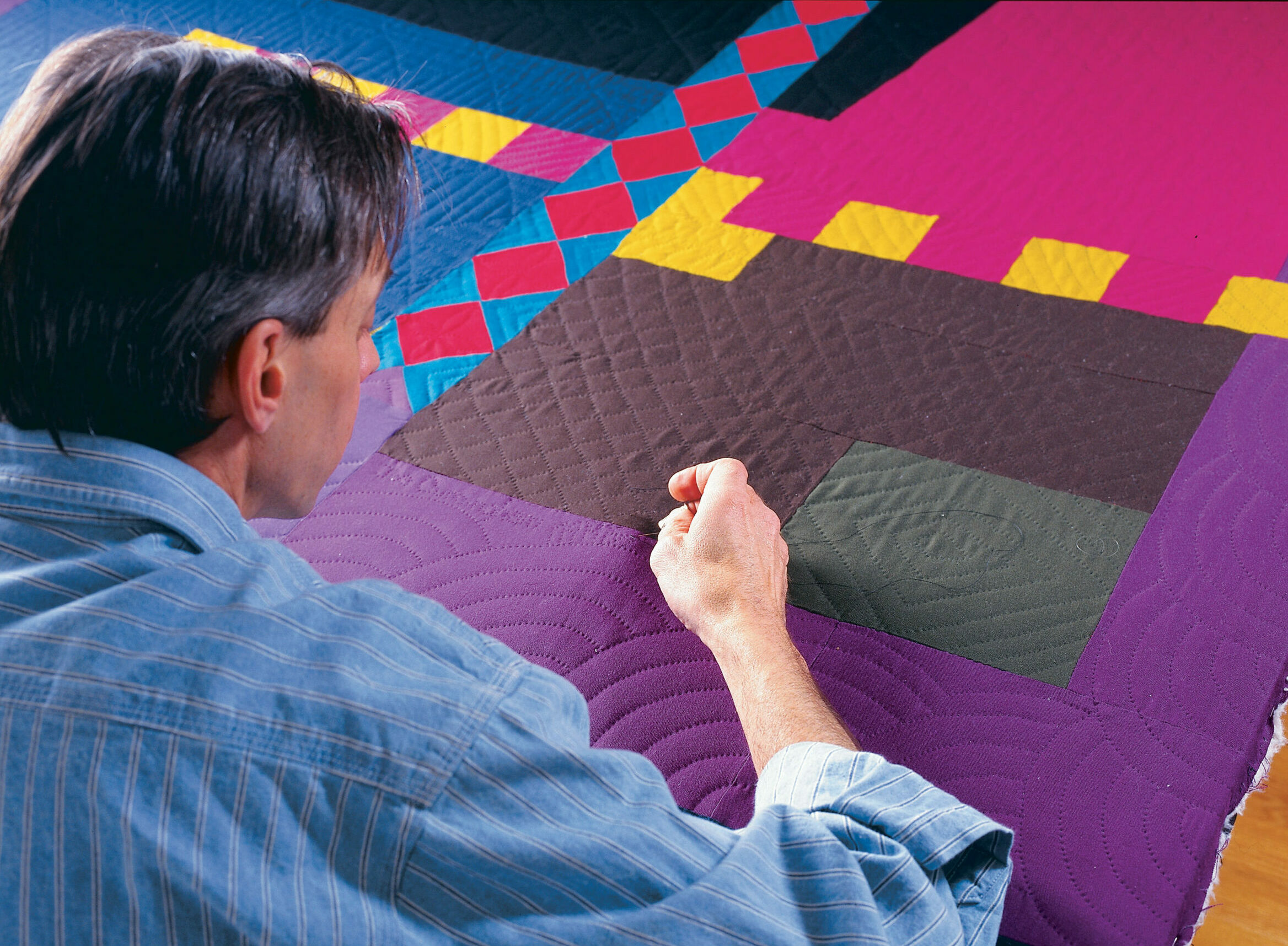 Man quilting 