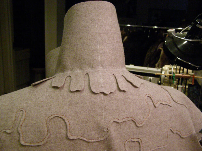 matching the the collar's center backs and neck seams to the coat body