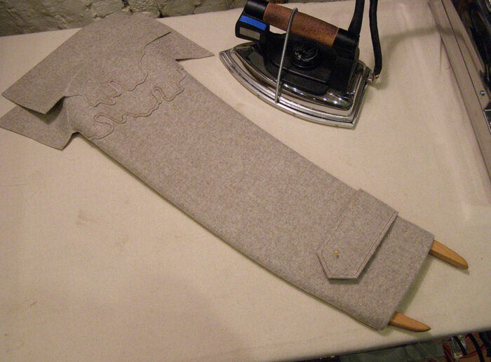 Sew the back sleeve seam as a lapped seam, and install the cuff latch