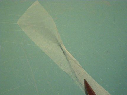 fold and press the illusion veiling in half lengthwise