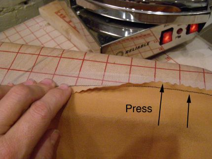 Press the strip towards the seam allowances.