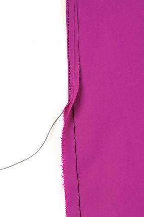 Sew the seam, fold the seam allowance over, and stitch again.