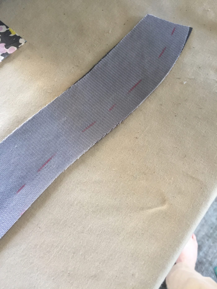 Red dashed line marks 1/2-inch from the edge on the wrong side of the interfaced collar stand