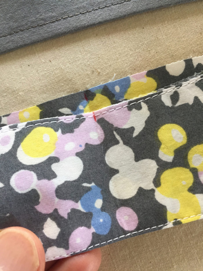 Center markings on the shirt collar and collar stand are aligned before sewing