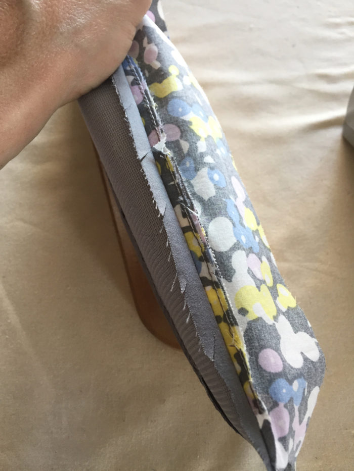 Seam allowances of the sewn collar are graded from the wrong side
