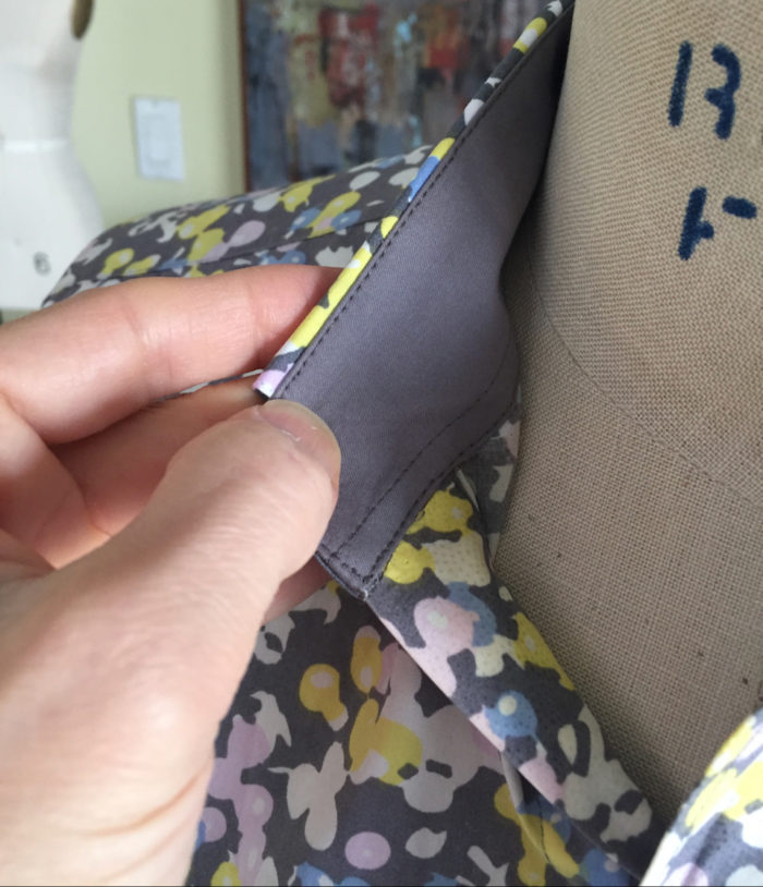 Close-up of gray collar stand on printed men's shirt collar