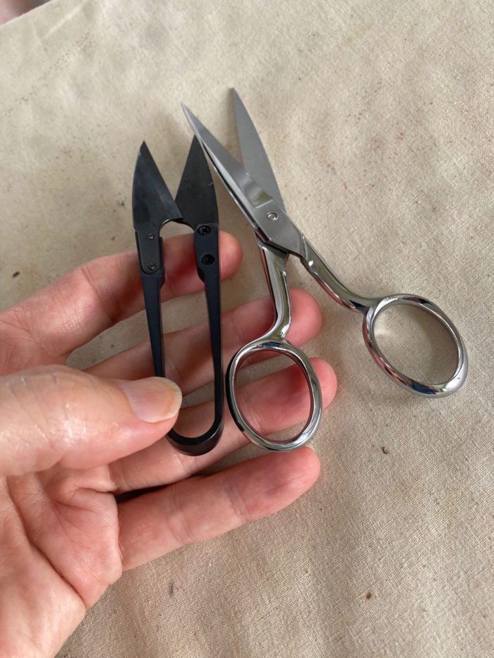 Sewing tools: a pair of snippers and a pair of small scissors