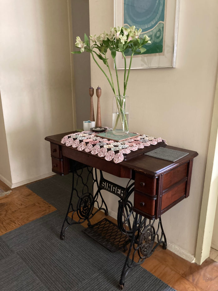 Vintage Singer treadle machine being used as an accent table