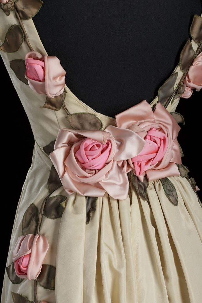 Floral detail on an ivory silk dress designed by Ann Cole Lowe, circa 1966