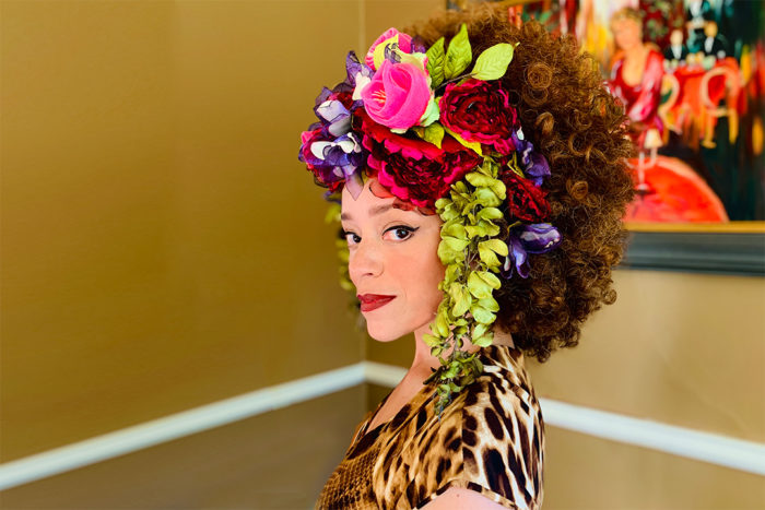 Marcy Harriell wears her headpiece of colorful flowers