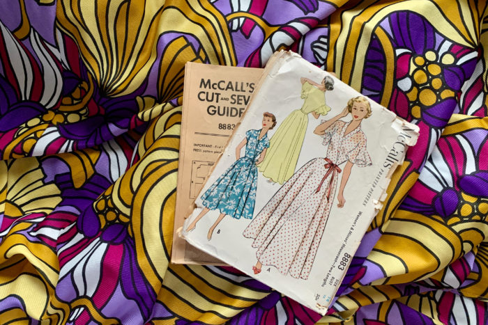 McCall's 8883 housecoat pattern and vibrant print polyester fabric were two thrift store finds