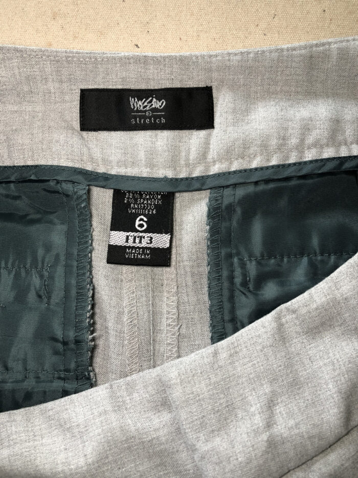 Maker's labels inside the back waistband on women's pants