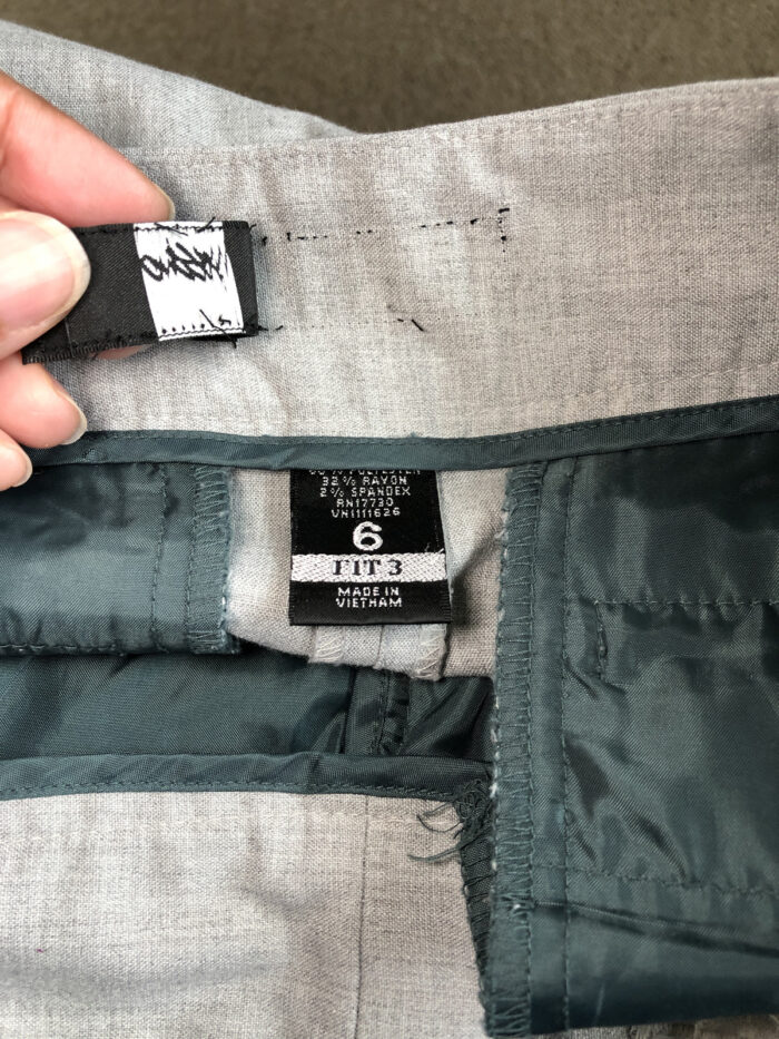 Removing the label from the waistband facing