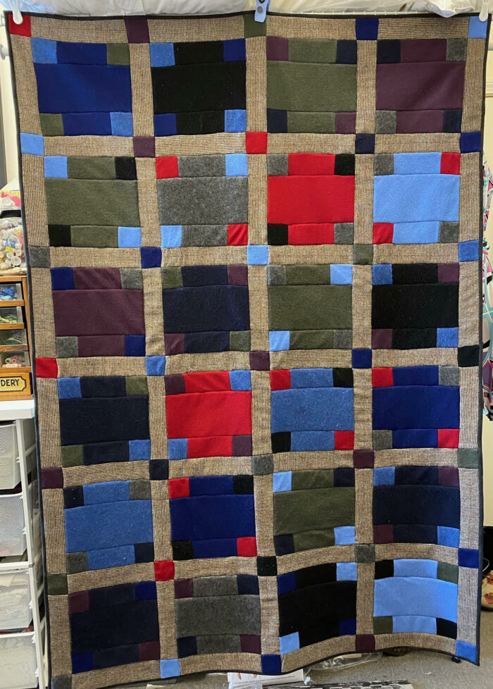 A quilt made from 8 upcycled sweaters.