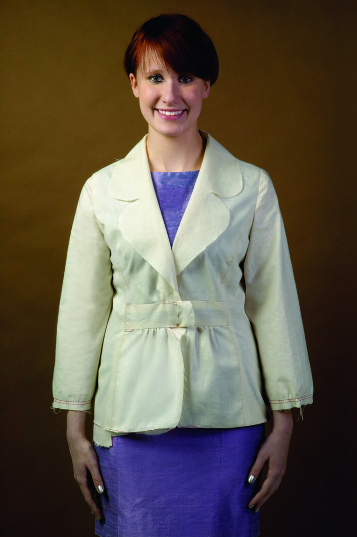 Model wears a jacket test garment, or muslin. 