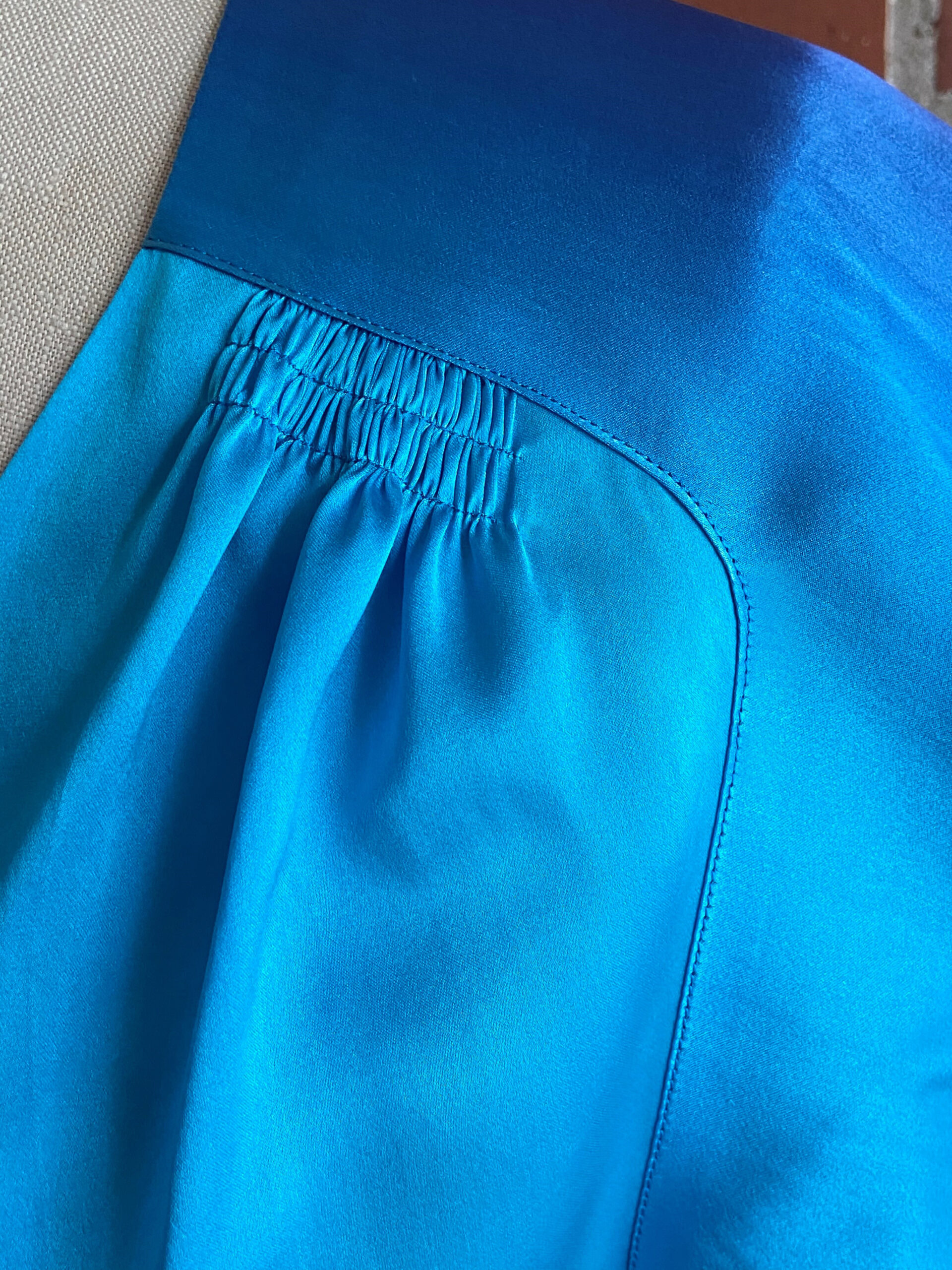 Close-up of lapped and appliqued seam on blouse shoulder