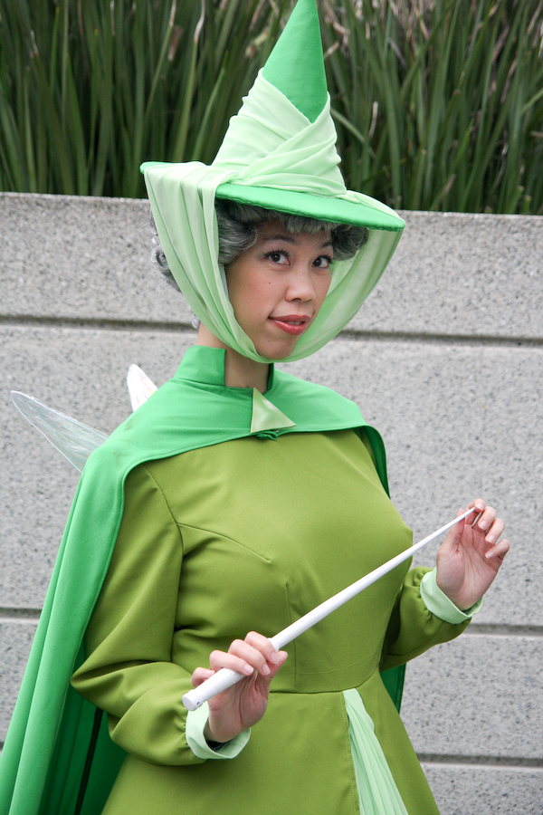 @confusedkittysewing wears a green, Disney-inspired costume.