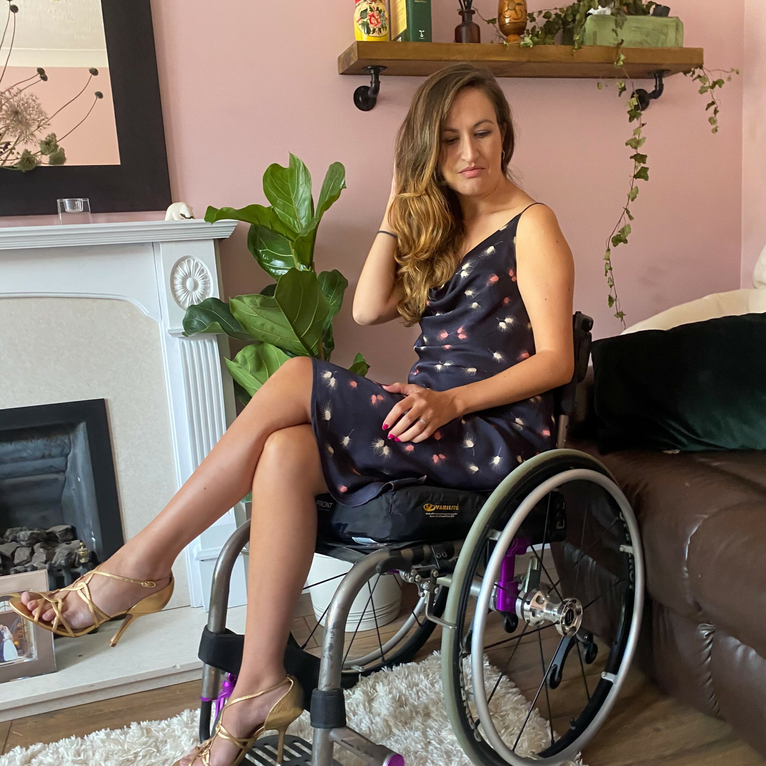 Marie Lawlor, in a wheelchair, wearing a floaty summer dress