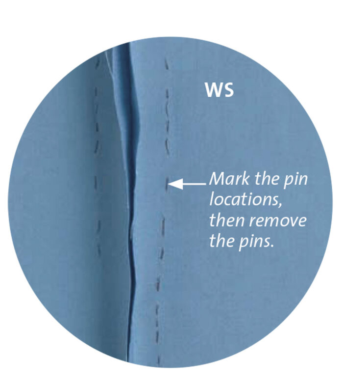 Mark the pin locations for ideal pants fitting