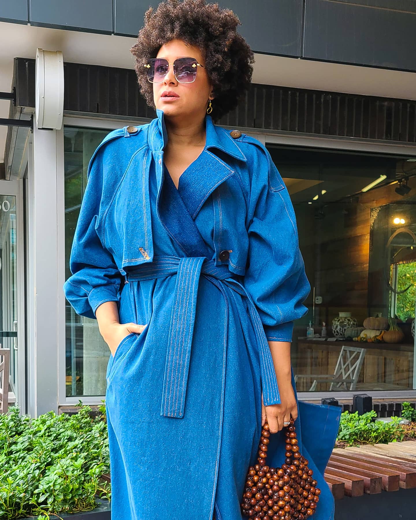 Marcia Spender in blue denim trench coat