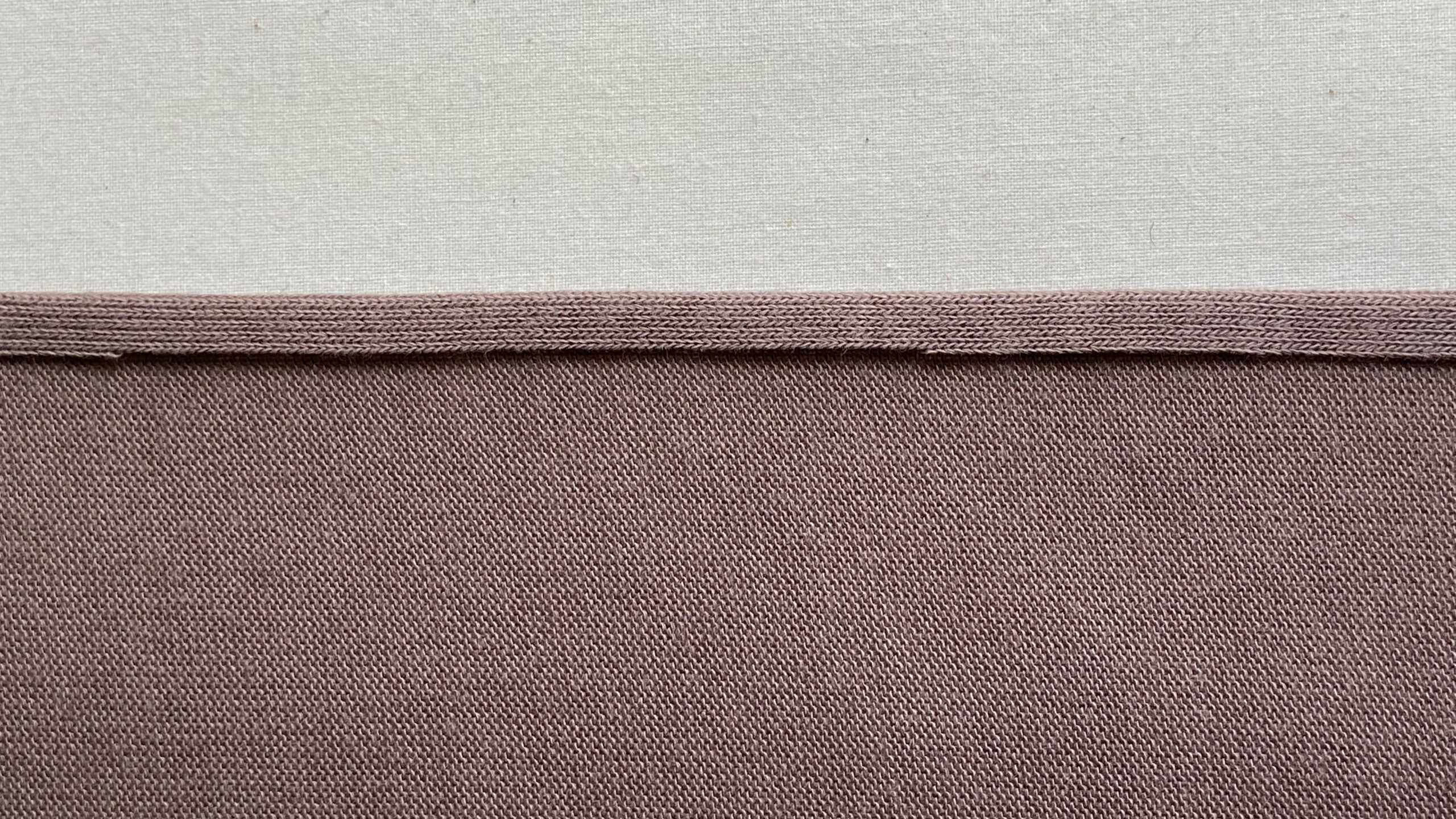 Folded under knit fabric edge