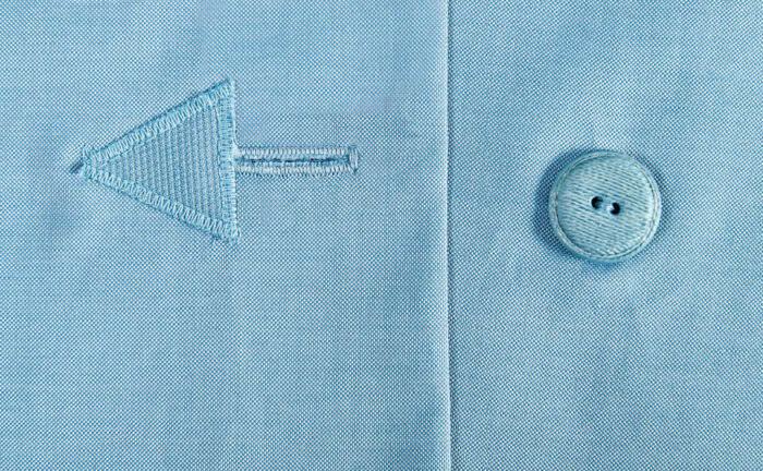 A machine satin stitch to appliqué the triangle in place.