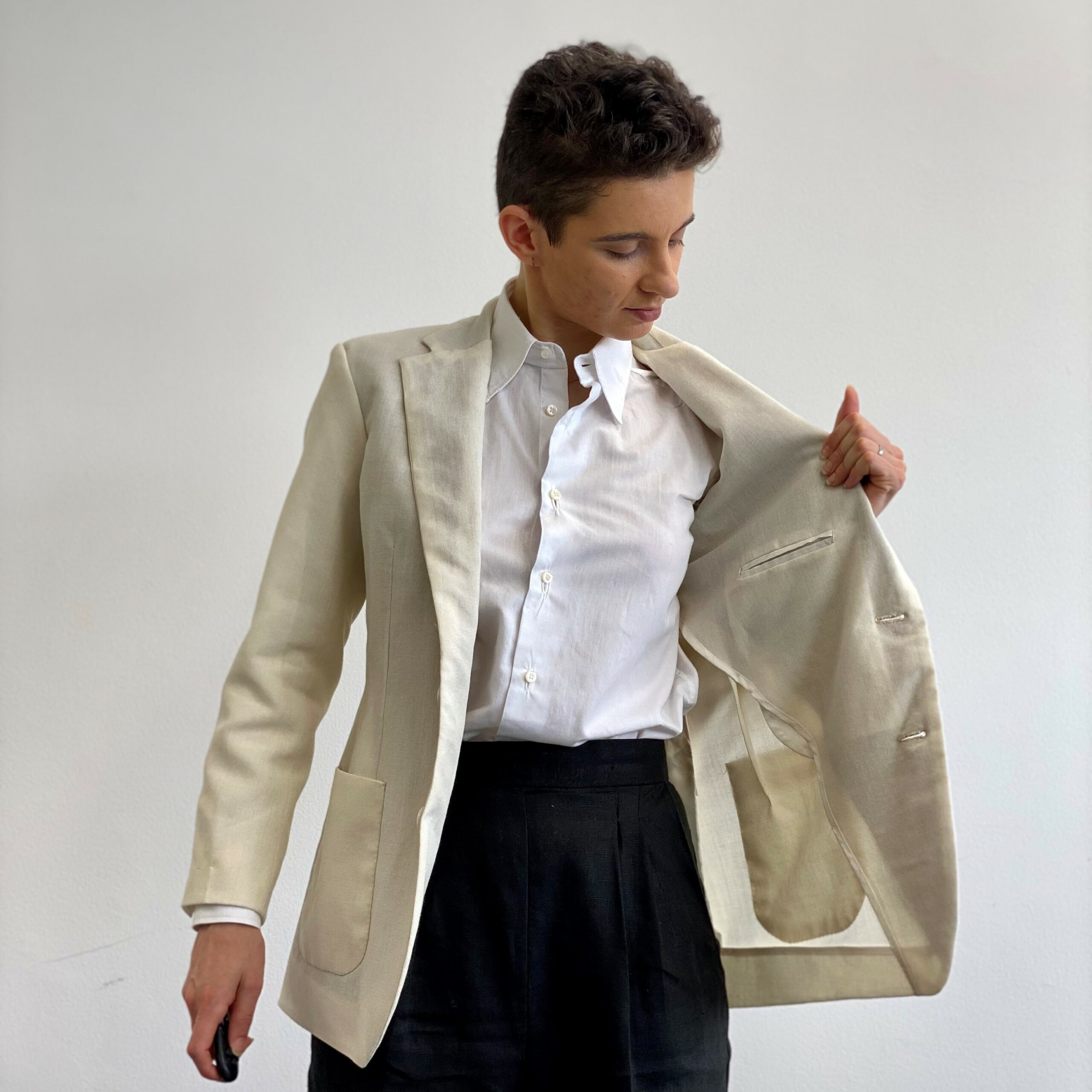 @emilia_to_nuno in a self-made white wool jacket, showing unlined interior. 