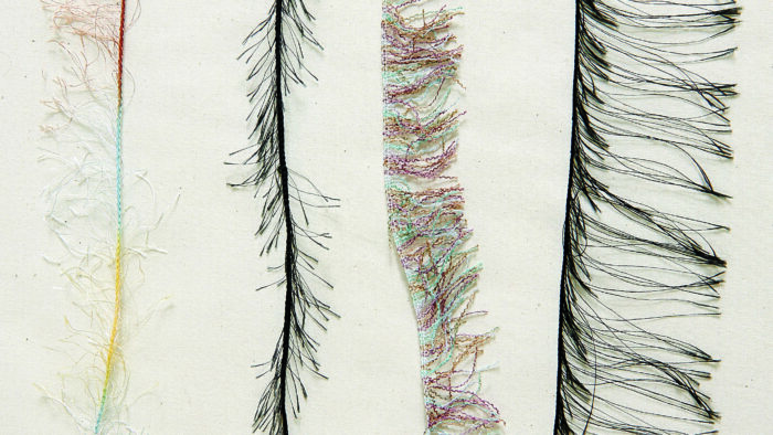 Four samples of eyelash yarn strands