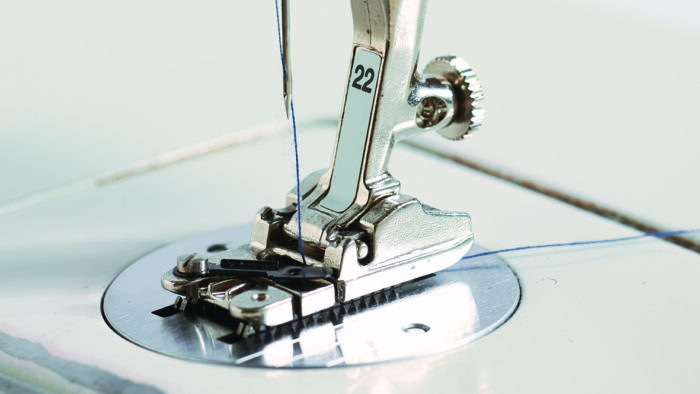 Close up photo of the couching presser foot on a sewing machine