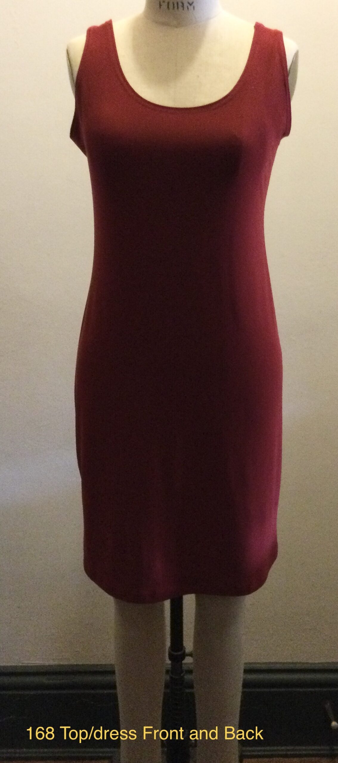 Sleeveless red dress on dress form