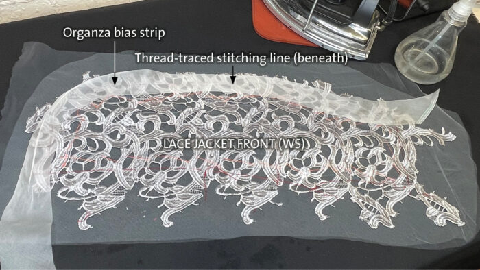 Stabilize lace edges with organza bias strips