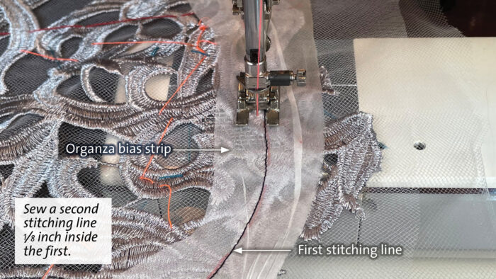 Stabilize lace edges: Machine-sew the organza strip in place