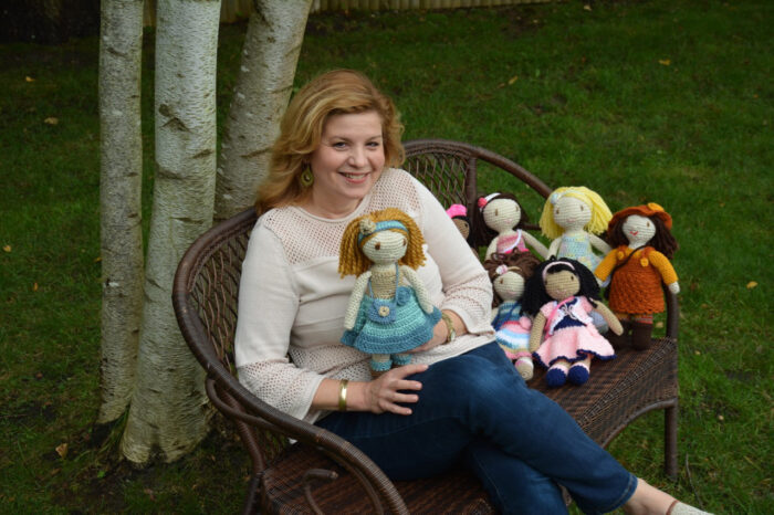 Debra Scala Giokas with her crocheted dolls 