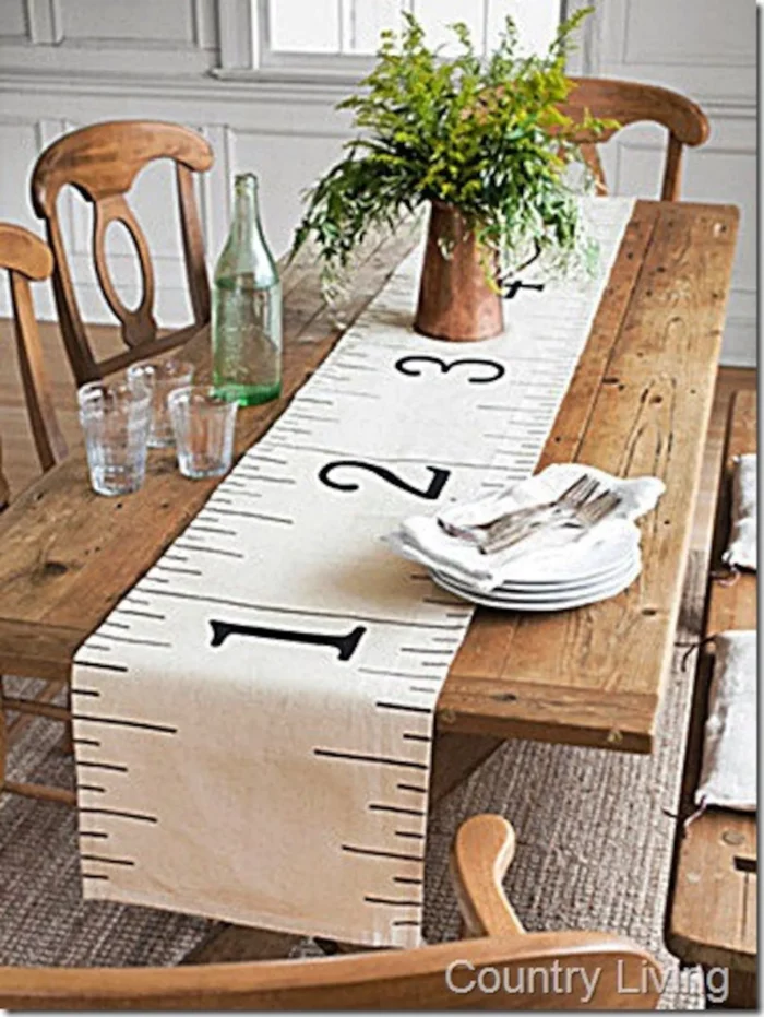 measuring tape table runner lying on on a dining table from Vanessa Hawthorne