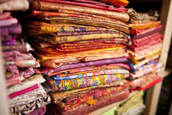 piles of colorful fabrics