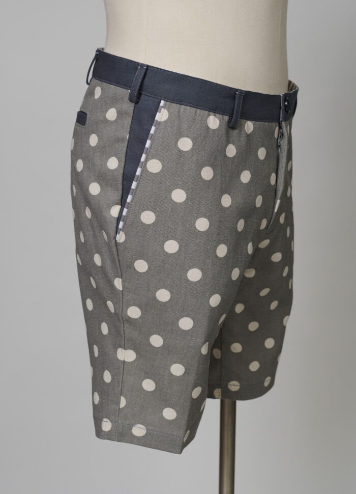 Men's polka dot shorts on dress form, side view