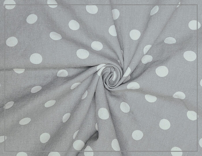 Light gray-and-white polka dot fabric scrunched up