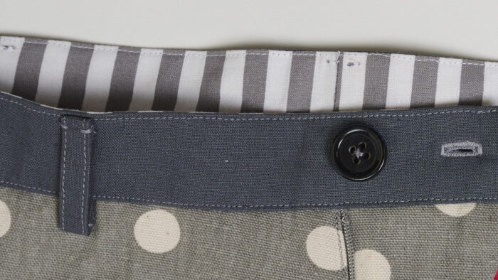 Close-up of waistband with contrasting striped fabric on the inside