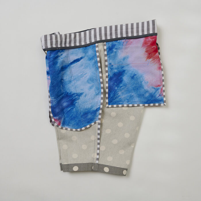 Side view of colorful shorts turned inside out to show tie-dye fabric pocket bags