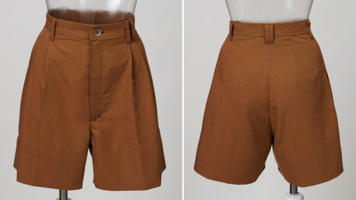 Brown shorts on dress form, front and back