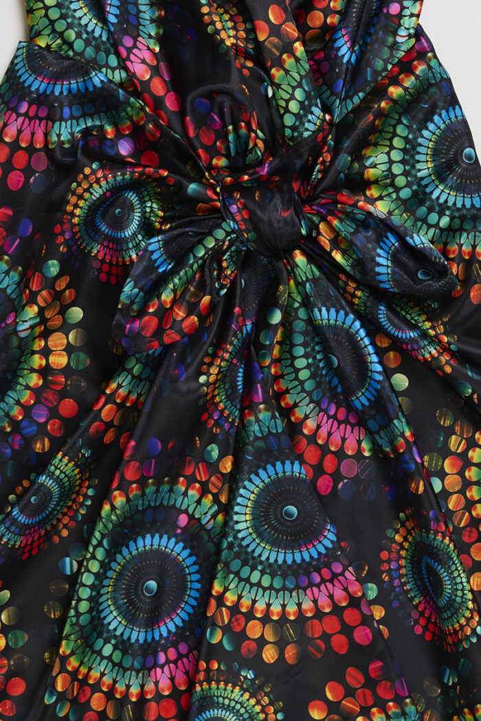 Close-up of front knot on multicolored dress