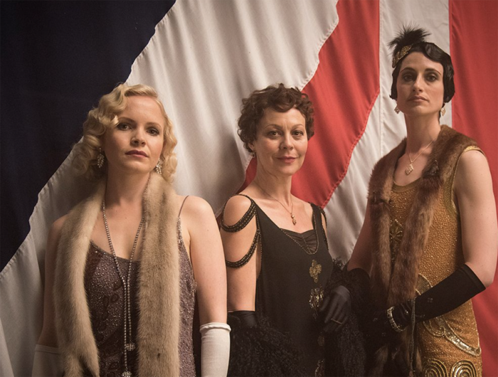 Three women wearing 1920s' flapper looks