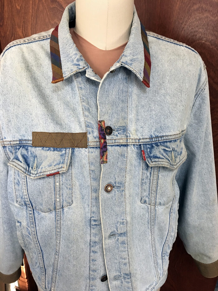 New bound edge on collar and small section of denim jacket front 