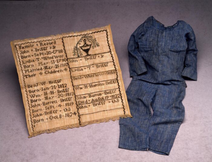 Hand-sewn linen suit and embroidered family record at the DAR Museum