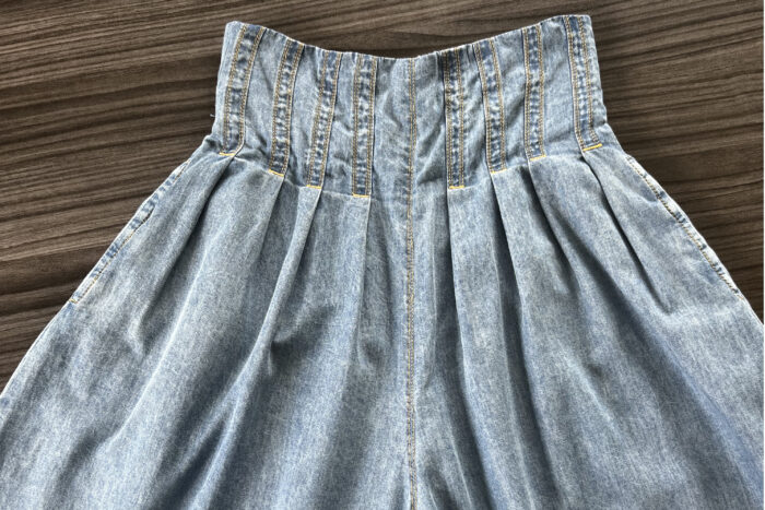 High-waisted pleated trousers by Janessa Cajudoy
